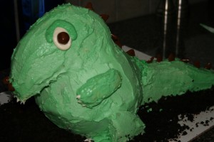 The cartoonish dinosaur cake