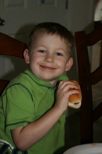 Benjamin enjoying a hotdog