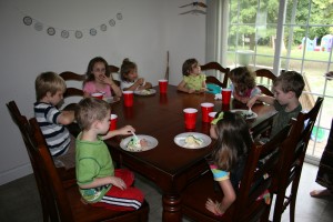 Party goers enjoy cake and ice cream