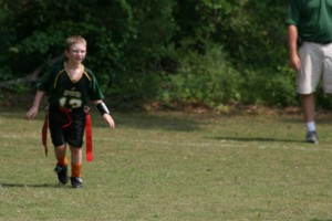 Alexander playing flag football